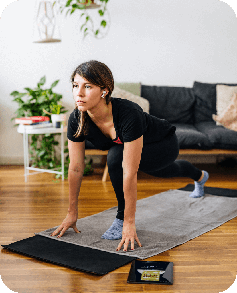 A person doing yoga whilst listening to blinks on Blinkist